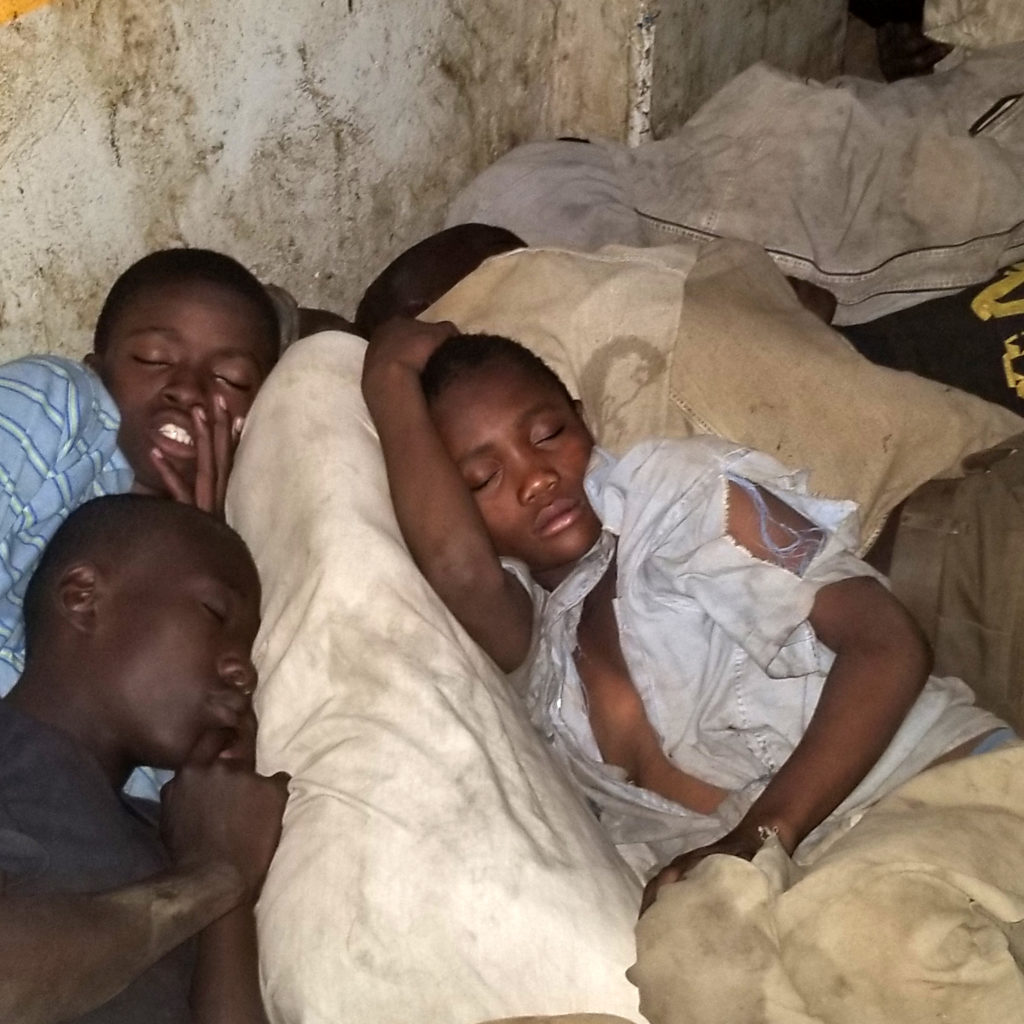 Boys sleeping on the street in Kisenyi, Kampala, Uganda.