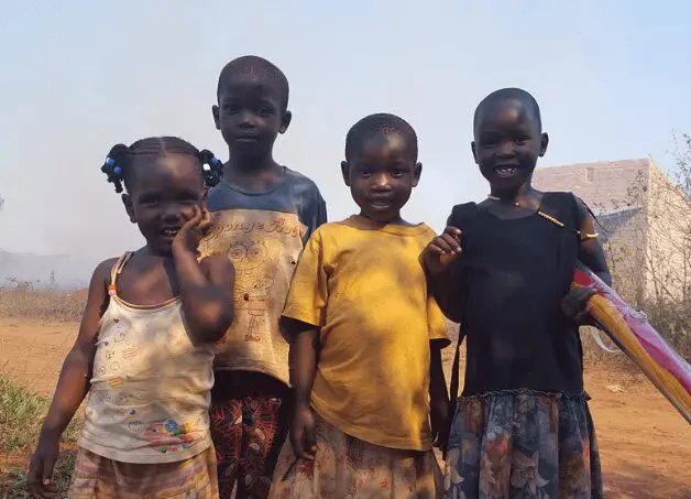 A group of children standing next to each other.