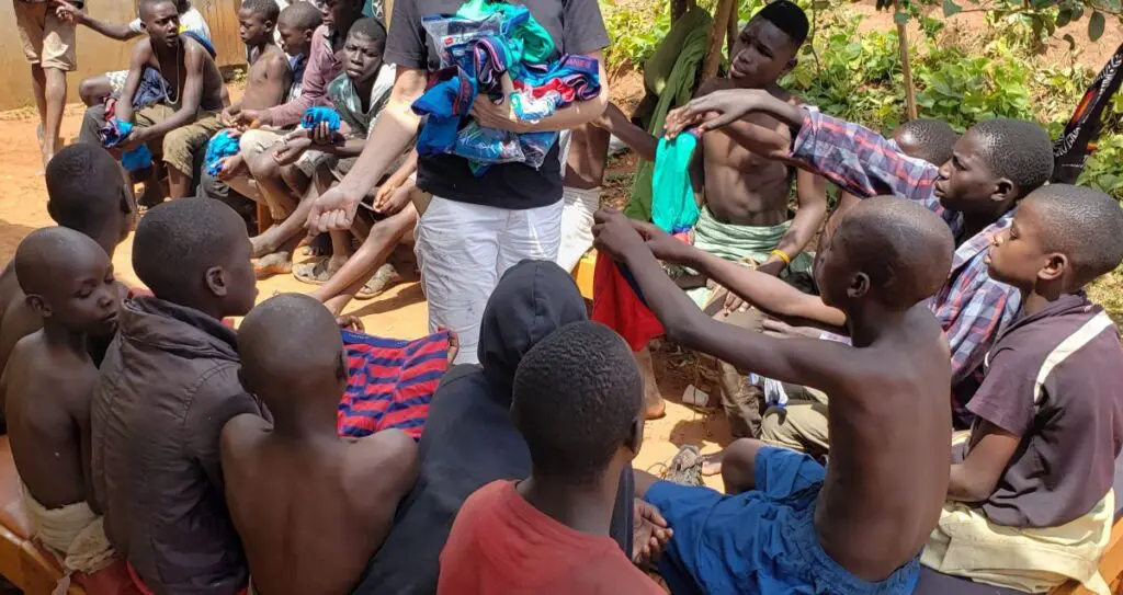 A group of people sitting on the ground.