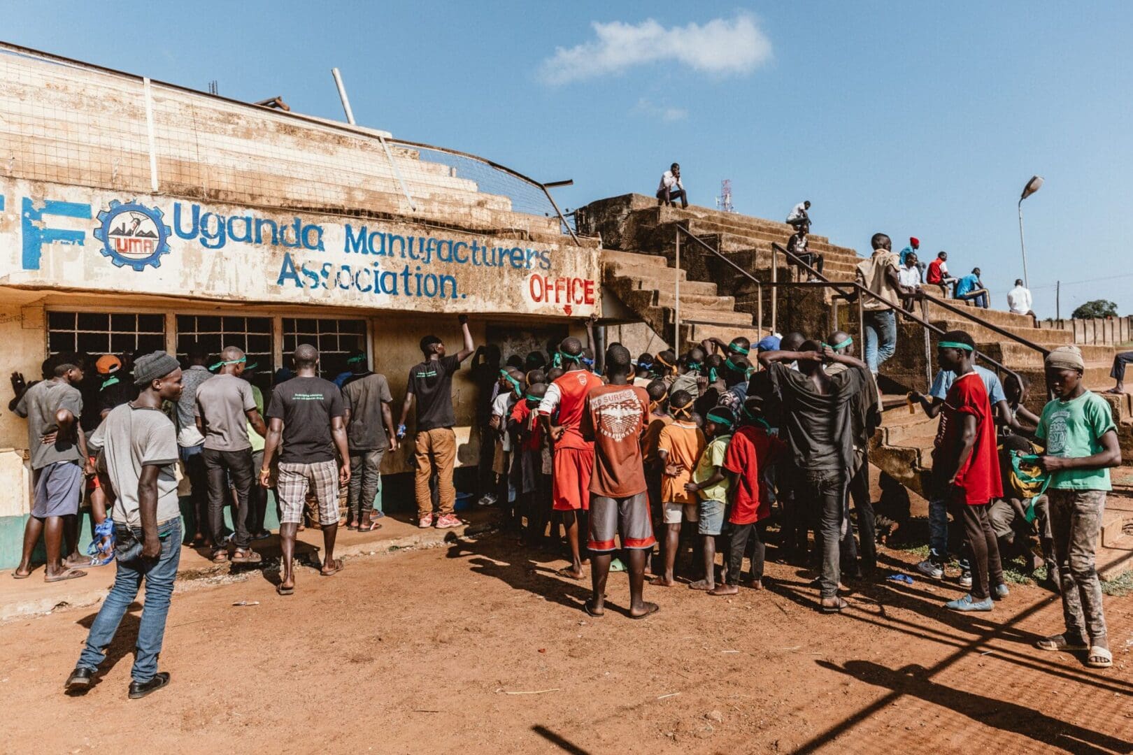 A group of people standing outside of a building.