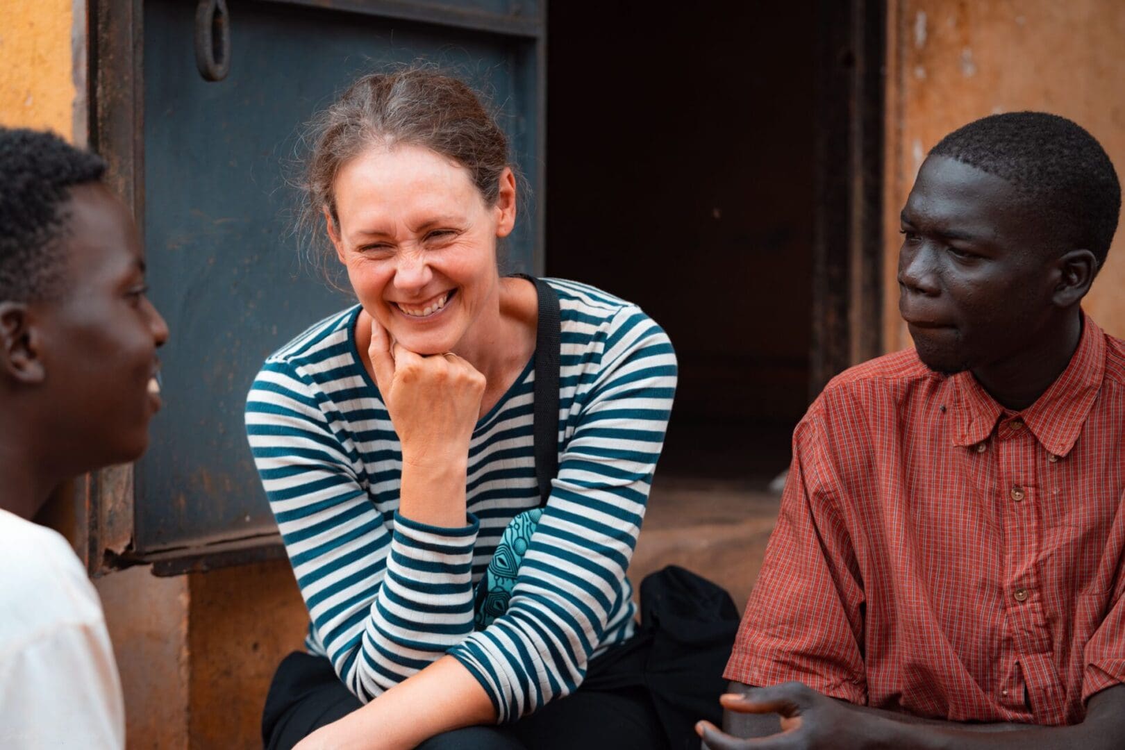 A woman sitting next to an older man.